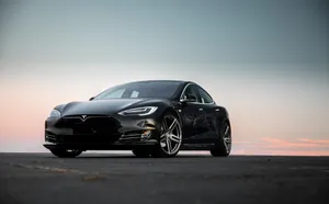 Futuristic Hybrid Car On The Road Wallpaper