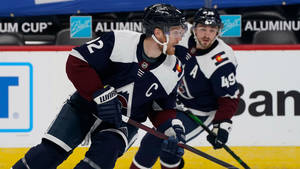 Gabriel Landeskog And Sam Girard In Action Wallpaper