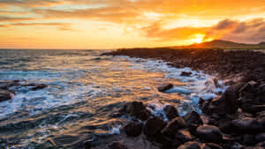 Galapagos Sunset Over Volcanic Rocks Wallpaper