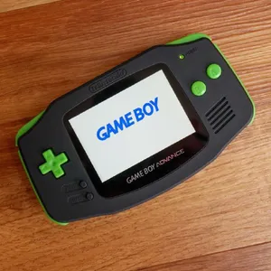Game Boy Advance On Wooden Background Wallpaper