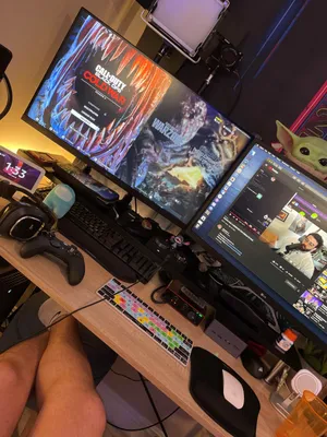 Gamer Setupwith Dual Monitorsand Streaming Equipment Wallpaper