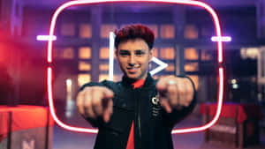 Gamer With Neon Play Button Background.jpg Wallpaper