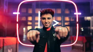 Gamer With Neon Play Button Background.jpg Wallpaper