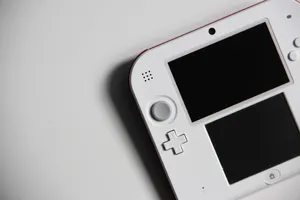 Gaming Consoles With Colorful Led Lights Setup In A Dark Room Wallpaper