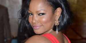 Garcelle Beauvais Smiling Radiantly In A Casual Outfit Wallpaper