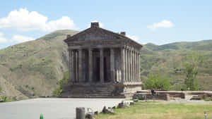 Garni Temple Under Pale Blue Sky Wallpaper