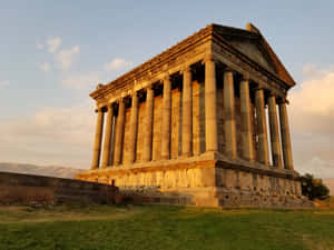 Garni Temple With Orange-tinted Clouds Wallpaper