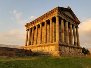 Garni Temple With Orange-tinted Clouds Wallpaper