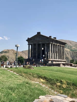 Garni Temple With Tourists On Walkway Wallpaper