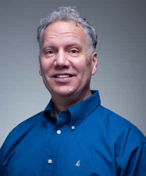 Gary Johnson In Blue With A Gray Backdrop Wallpaper