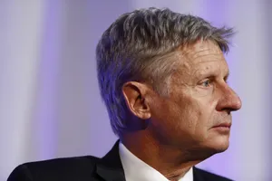 Gary Johnson Looking Sideways With A Purple Backdrop Wallpaper