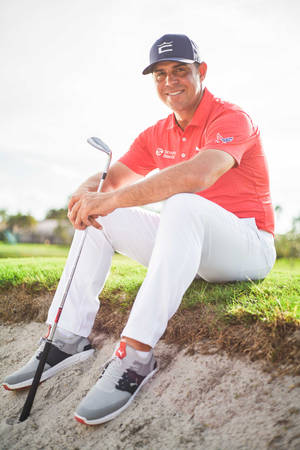 Gary Woodland Sitting On Grass Wallpaper