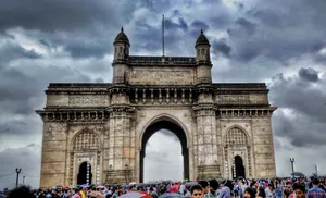 Gateway To India Crowds Gray Sky Wallpaper