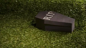 Gather Around The Haunted Halloween Graveyard With Spooky Coffins Wallpaper