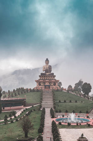 Gautam Buddha Statue On A Hill Wallpaper