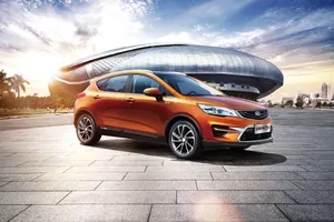 Geely Emgrand Orange Sedan Sunrise Cityscape Wallpaper