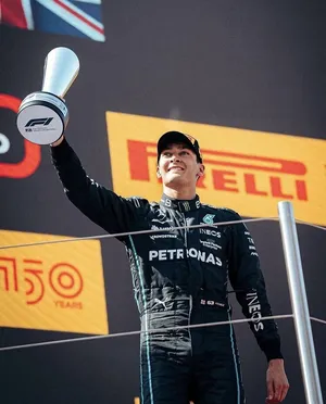 George Russel Holding His Trophy Up Wallpaper