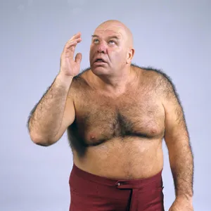 George Steele Wearing Maroon Trouser Wallpaper