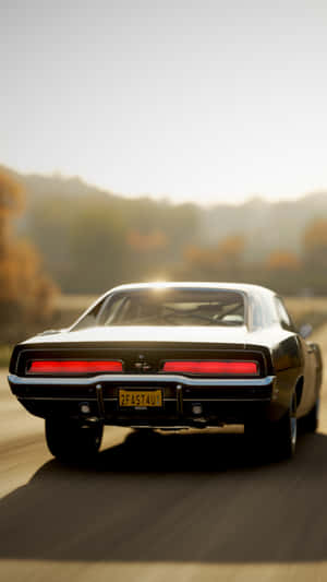 Get Behind The Wheel Of The Classic Dodge Charger With This Iphone Wallpaper Wallpaper