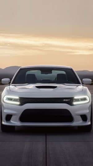 Get Charged Up For An Awesome Experience With The Dodge Charger Iphone. Wallpaper