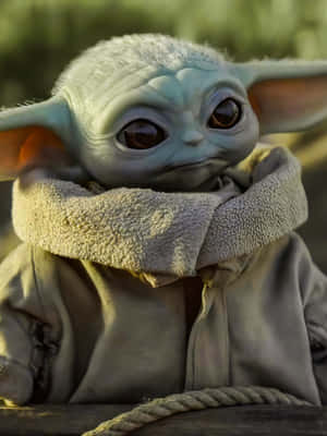 Get Ready To Experience The Cuteness Of Baby Yoda With This Amazing New Phone! Wallpaper