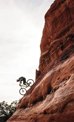 Get The Rush With A Mountain Bike On Ragged Terrain! Wallpaper