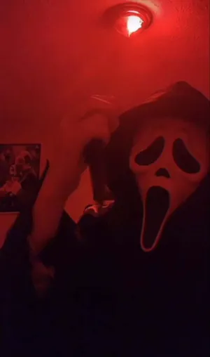 Ghostface Mask Illuminated In Neon Lights Wallpaper