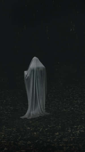 Ghostly_ Figure_in_ Darkness Wallpaper