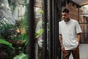 Gianlucca Scamacca Leaning Against The Window Wallpaper