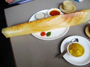 Giant Dosawith Chutneysand Sambar Wallpaper