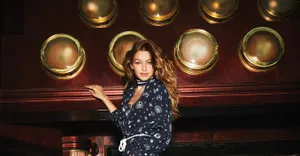 Gigi Hadid On Bar Top Wallpaper