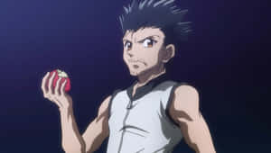 Ging Freecss Striking A Pose In An Action-packed Scene Wallpaper