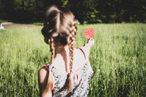 Girl Holding Mothers Day Card Wallpaper