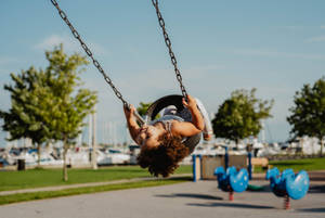 Girl On Tire Playground Swing Wallpaper