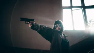 Girl Pointing A Gun Wallpaper