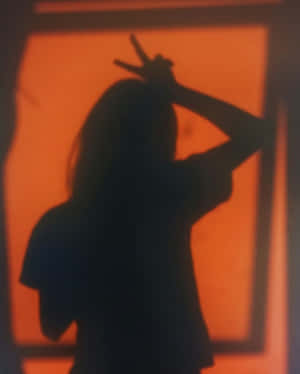 Girl's Orange Shadow Pfp Wallpaper