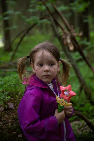 Girlin Purple Jacket Holding Toy Flower Wallpaper