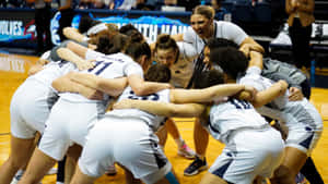 Girls Basketball Team Huddle Motivation Wallpaper