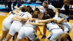 Girls Basketball Team Huddle Motivation Wallpaper