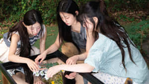 Girls Exploring Nature Together Wallpaper