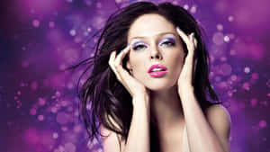 Glamorous Coco Rocha Striking A Pose In An Outdoor Setting. Wallpaper