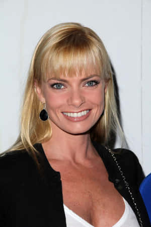 Glamorous Jaime Pressly Posing During A Photo Shoot Wallpaper