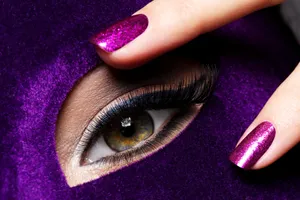 Glamorous Purple Nail Polishand Eye Makeup Wallpaper