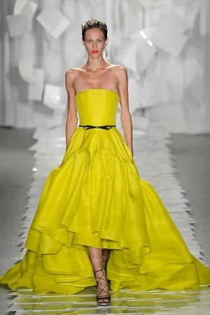 Glamorous Woman In Stylish Yellow Outfit Wallpaper