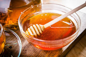 Glass Bowl Of Honey Wallpaper