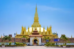 Gleaming Pha That Luang In Vientiane Wallpaper