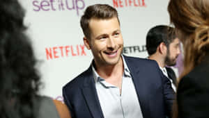 Glen Powell Netflix Event Smile Wallpaper