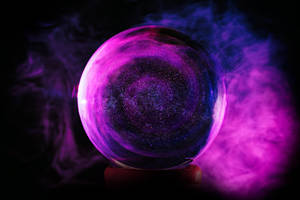 Glistening Purple Glass Sphere In A World Of Sparkle Wallpaper