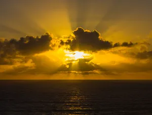 Glorious Sun Behind Clouds Wallpaper