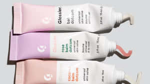 Glossier Balm Dotcom Trio Skincare Products Wallpaper